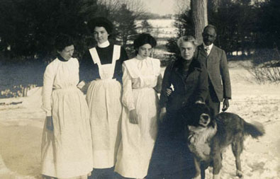 Informal group portrait of the Codman House domestics with the family dog, Rover: Ellen, Nelly, Mary, Reine, and Watson.