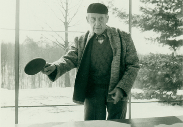 Walter Gropius playing ping pong, Gropius House, Lincoln, Mass.
