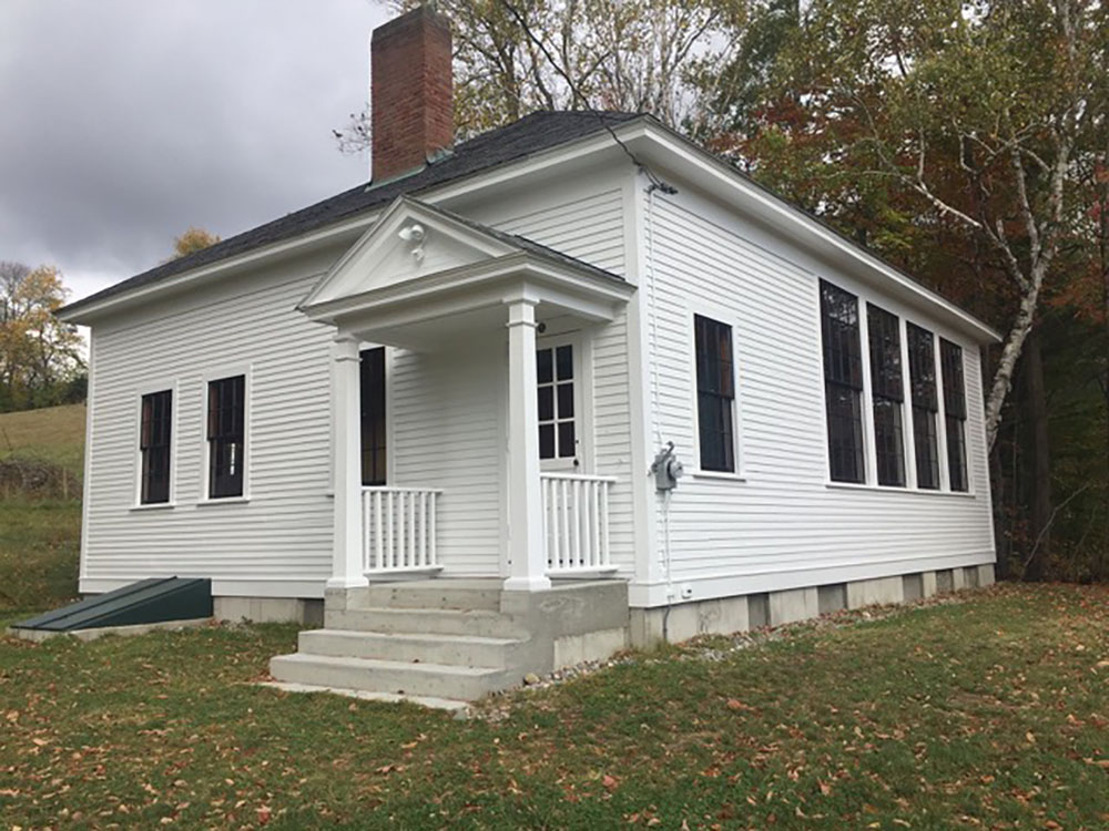 Exterior of Root Schoolhouse, a one-room schoolhouse in Norwich, Vt., showing building after restoration.